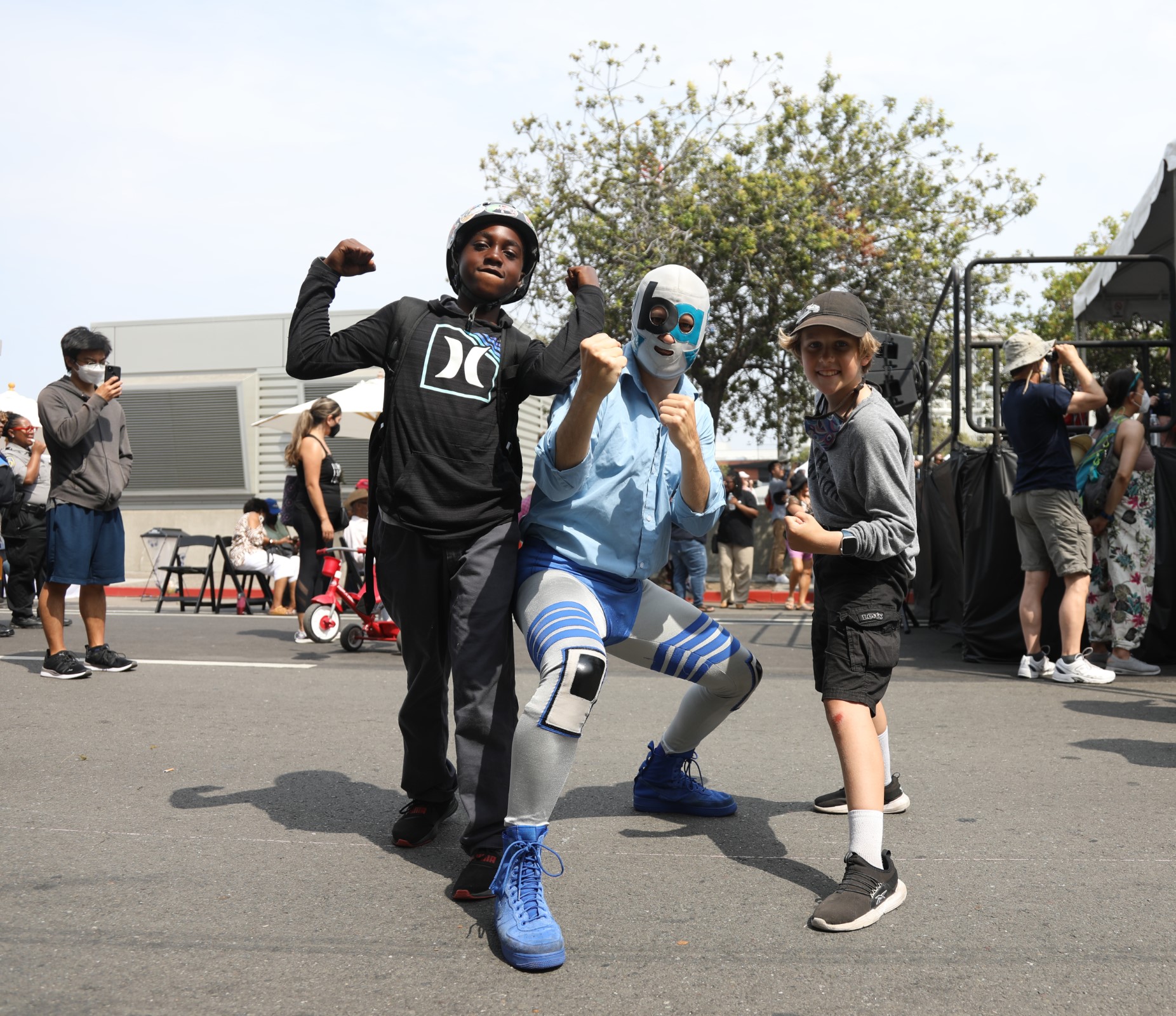 Lucha libre wrestler BART-Man poses with fans at BART’s 50th Anniversary Celebration and Family Fun Festival on Sept. 10, 2022. 