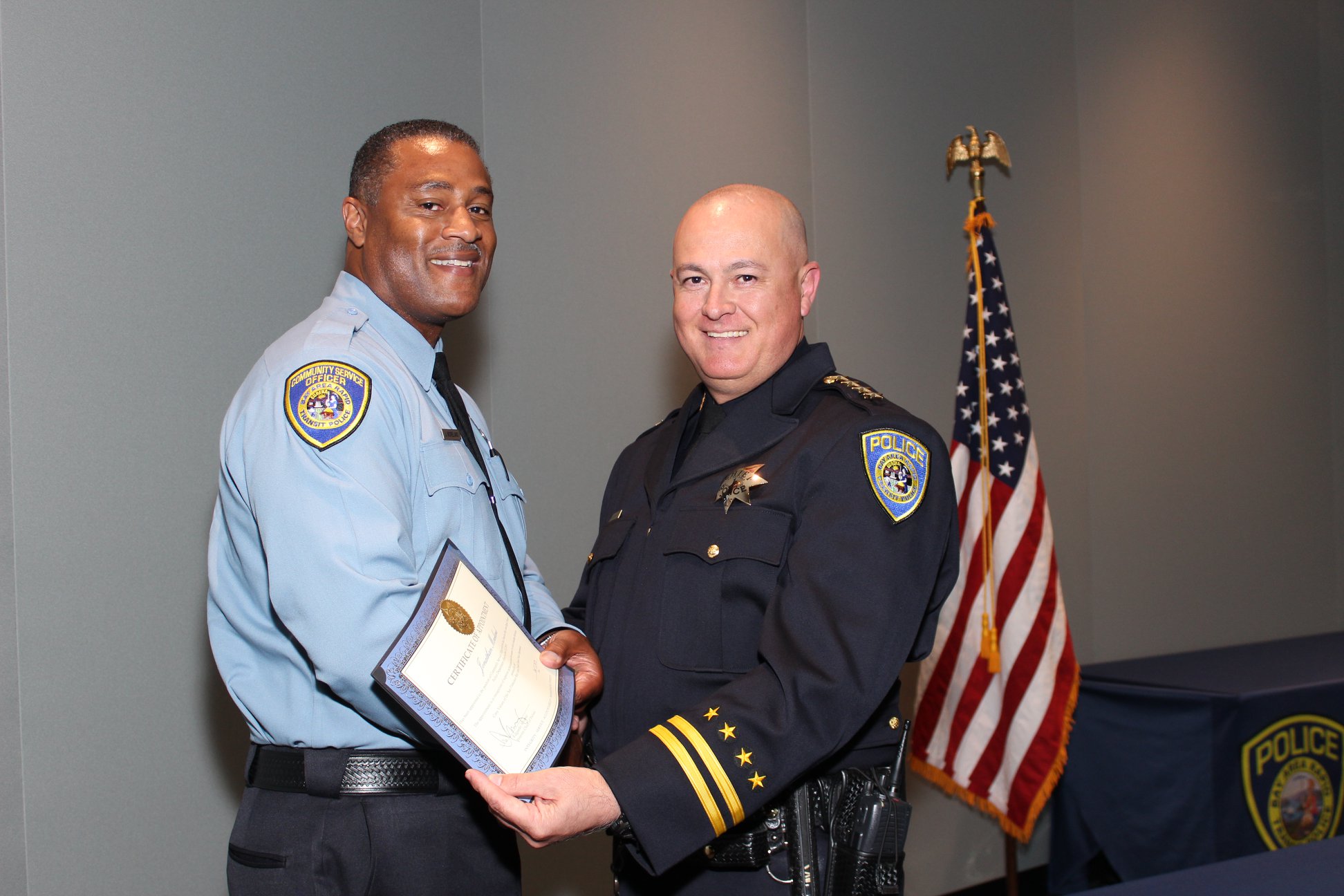 Interim Chief Ed Alvarez poses with sworn-in Community Service Officer