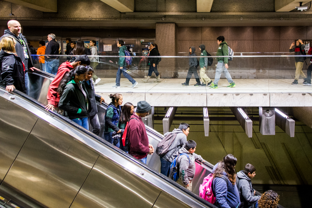 people going down the escalator downtown SF