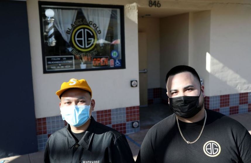 Mark DeGuzman, left, and Jamie Anabeza outside Black and Gold East Bay in Hayward