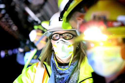 Managers overseeing work on cable pull operation