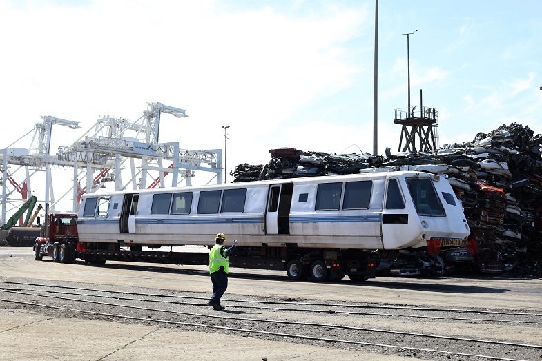 Car 1208 on flatbed truck arriving at the Schnitzer Steel facility in Oakland 