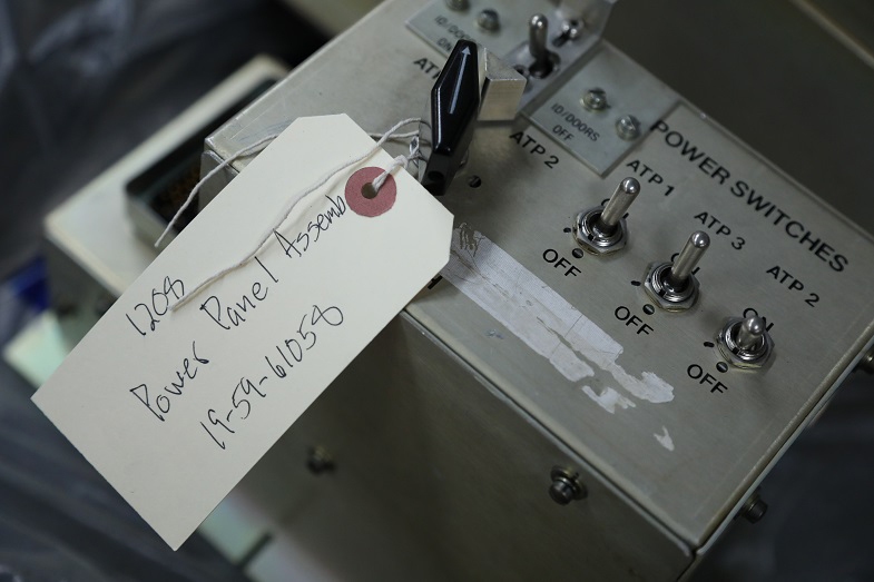 A power panel assembly is tagged and logged before it goes into spare parts storage