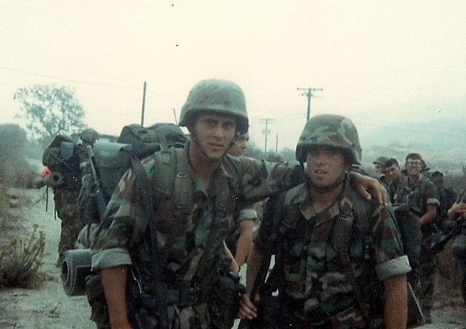 Frank Bautista (left) and a friend while serving in the Marine Corps Reserves. 