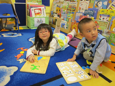 cihldren work on puzzles