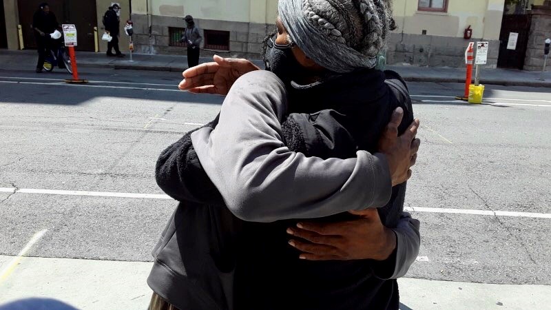 Sonja Hagins Perry hugs her son after they were reunited in San Francisco 