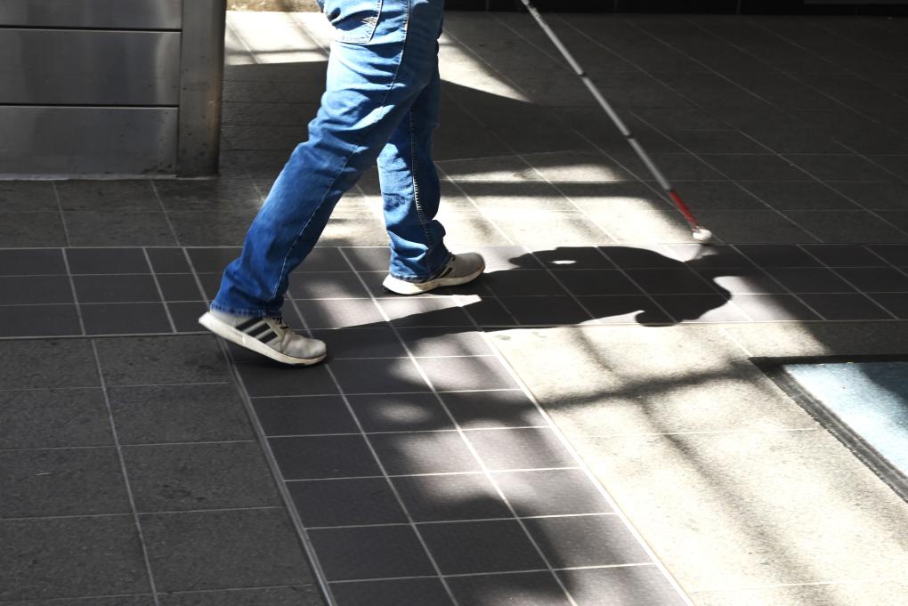 BART intern Erik Huizar studies the tactile guideway at Union City Station on Wednesday, Sept. 6, 2023.