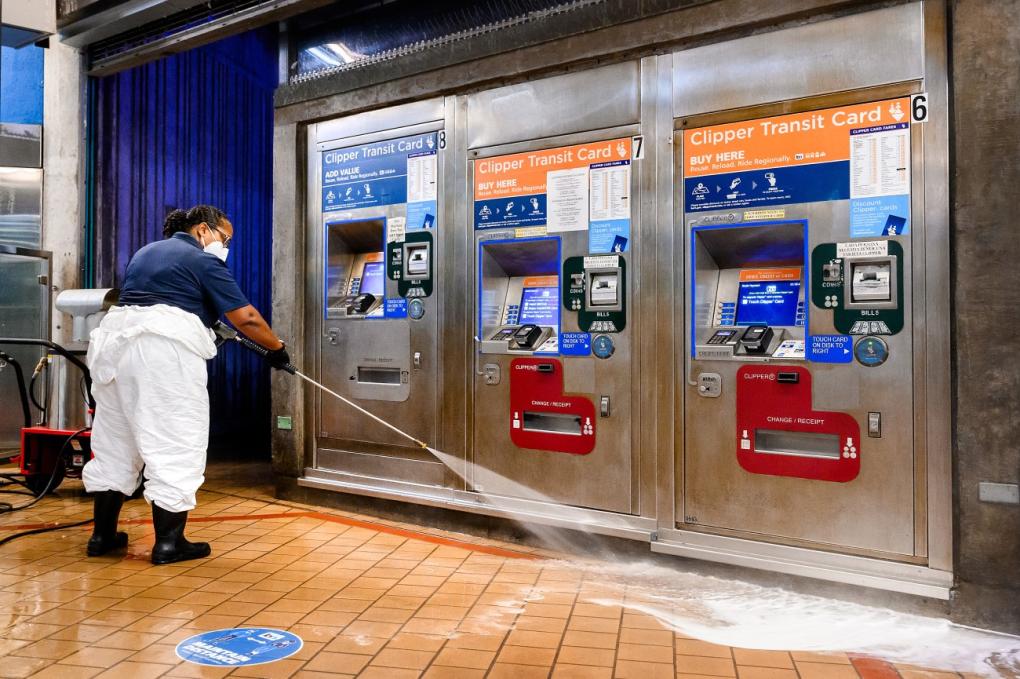 Sudsy water is power washed away near the Add Fare Machines.  