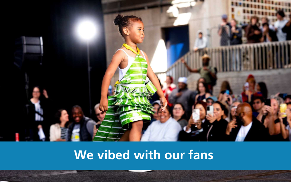 Photo of a girl in a paper ticket dress with text "We vibed with our fans"