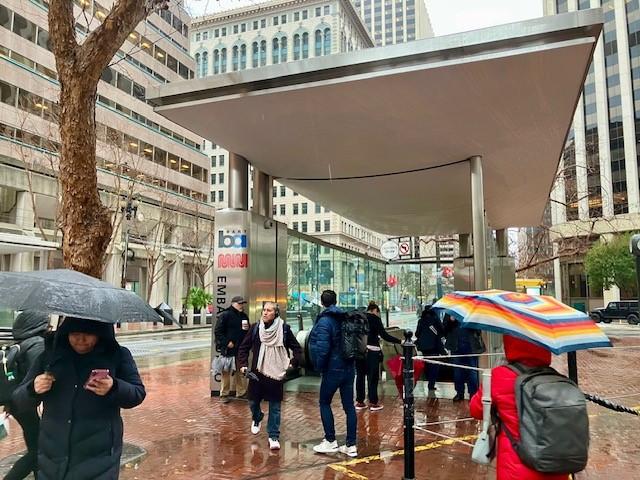 A new canopy shelters an Embarcadero entrance from the rain